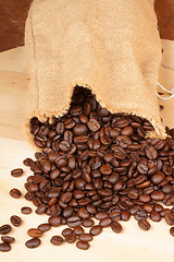 Image showing Coffee beans out of a hopsack