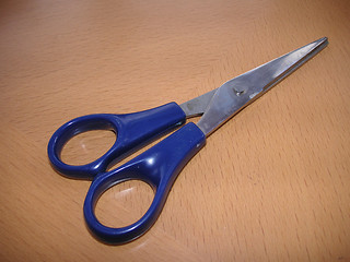 Image showing scissors on a wooden desk