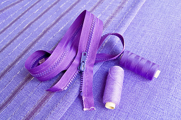 Image showing Locking zipper and thread on the purple fabric