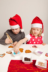 Image showing Girls decorating gingerbread cookies