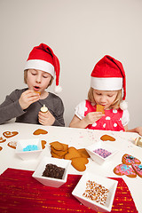 Image showing Girls decorating gingerbread cookies