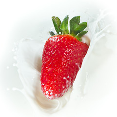 Image showing strawberry splashing into milk