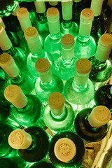 Image showing wine bottles stacked up