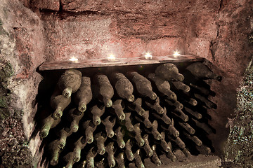 Image showing wine bottles with candles