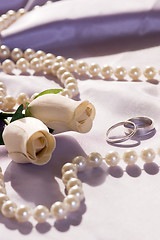 Image showing wedding rings and roses