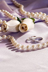 Image showing wedding rings and roses