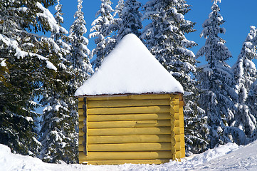 Image showing Log cabin in snowy forest