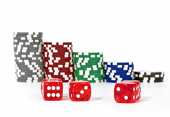 Image showing Piled poker chips with dice