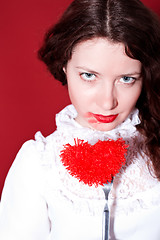 Image showing woman with red heart on a fork