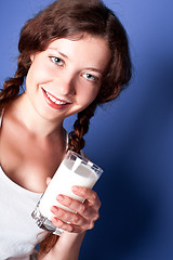 Image showing woman enjoying a glass milk