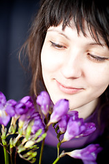 Image showing woman with purple flowers