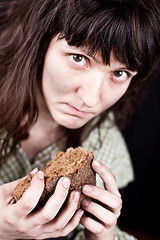 Image showing beggar woman with a piece of bread