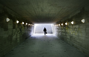 Image showing man passing through underpass 