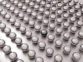 Image showing Black unique pearl among common ones in rows