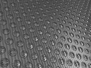 Image showing Carbon fibre surface with round buttons