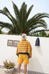 Image showing Man looking at the palm