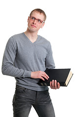 Image showing Young student in glasses with a book in their hands