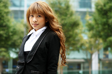 Image showing pretty asian business woman at office building 