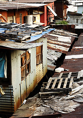 Image showing old rusty metal housing at day 