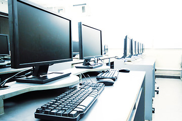 Image showing workplace room with computers in row 