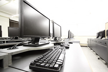 Image showing workplace room with computers in row 