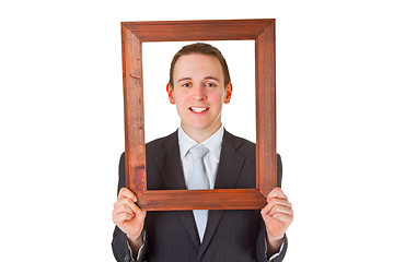 Image showing Businessman with wooden frame