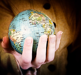 Image showing Globe in a girl's hands