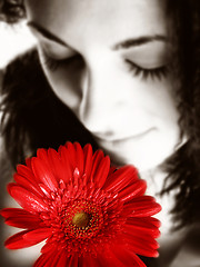 Image showing Girl with a red flower