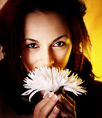 Image showing Girl with a white flower