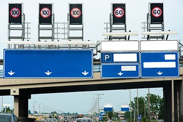 Image showing Highway with many signs and traffic