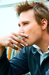 Image showing Closeup of a young man with cigarette in mouth