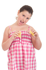 Image showing Girl eating chips