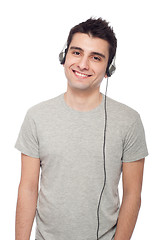 Image showing Casual man listening music