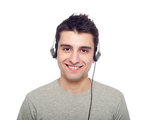 Image showing Casual man listening music