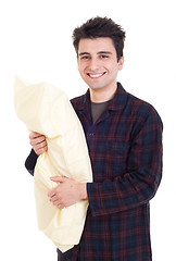 Image showing Man in pajamas holding pillow