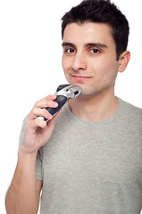 Image showing Young man shaving