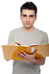 Image showing Man studying with dossier