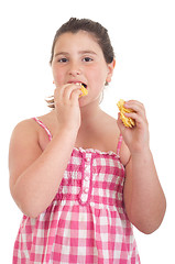 Image showing Girl eating chips