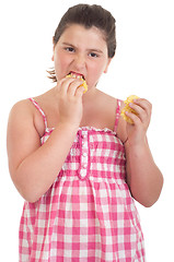 Image showing Girl eating chips