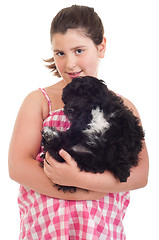 Image showing Girl holding dog