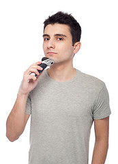 Image showing Young man shaving