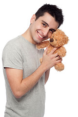 Image showing Man cludding teddy bear