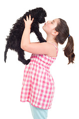 Image showing Girl kissing dog