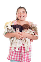 Image showing Little girl with dolls