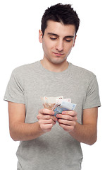 Image showing Man holding money