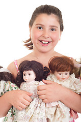 Image showing Little girl with dolls