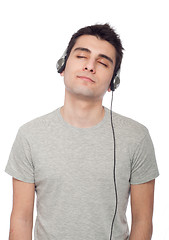 Image showing Casual man listening music