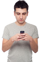 Image showing Casual man text messaging