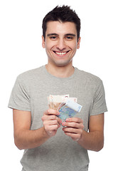 Image showing Man holding money