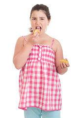 Image showing Girl eating chips